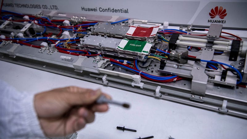 A Huawei engineer displays parts in the research and development area of the Bantian campus on April 12, 2019 in Shenzhen, China.