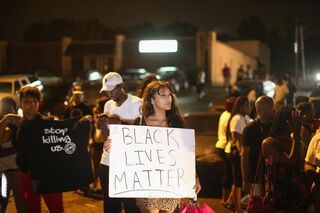 Demonstrators in Ferguson, Mo., Aug. 15, 2014, after the police killing of Michael BrownScott Olson/Getty Images