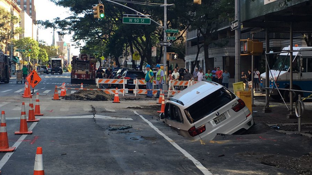 photo of Manhattan Sinkhole Swallows Very Expensive SUV image