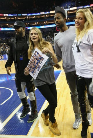 Model Cara Delevingne and singer Ellie Goulding attend the Eastern Conference NBA match between the Brooklyn Nets and Atlanta Hawks at London’s O2 Arena Jan. 16, 2014.Julian Finney/Getty Images