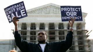 Protester in front of the Supreme Court as the court hears oral arguments in McCutcheon v. Federal Election Commission Oct. 8, 2013DREW ANGERER/GETTY IMAGES