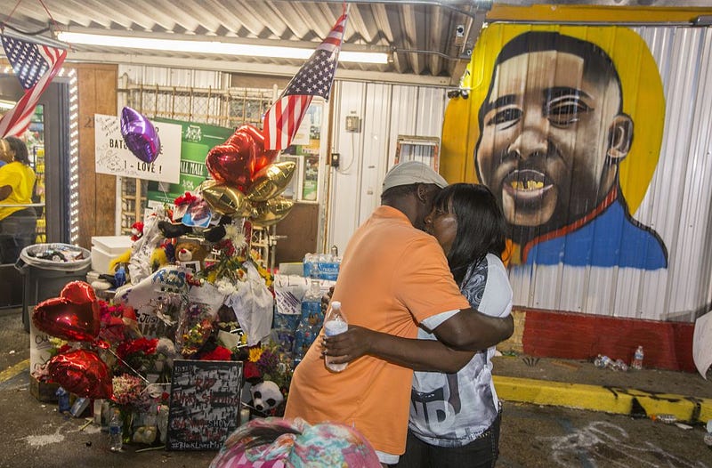 Sandra Sterling (right), Alton Sterling's aunt, visits his memorial on July 7, 2016, in Baton Rouge, La. (Mark Wallheiser/Getty Images)