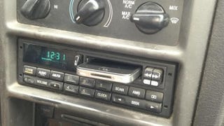 Illustration for article titled What the Strange Slot in Your Old Car's Dashboard Is Really For