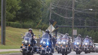 A police motorcade arrives at the funeral of Bobbi Kristina Brown at the St. James United Methodist Church Aug. 1, 2015, in Alpharetta, Ga. Â Â David A. Smith/Getty Images