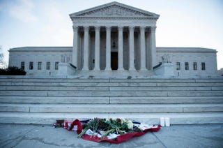 Flowers are placed in front of the U.S. Supreme Court Feb. 14, 2016, in Washington, D.C., in honor of Justice Antonin Scalia, who died Feb. 13, 2016, at the age of 79.BRENDAN SMIALOWSKI/AFP/Getty Images