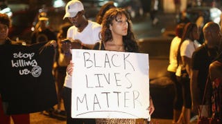 Demonstrators gather along West Florissant Avenue in Ferguson, Mo., Aug. 15, 2014, to protest the shooting death of Michael Brown.Scott Olson/Getty Images