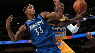 Dante Cunningham of the Minnesota Timberwolves and J.J. Hickson of the Denver NuggetsDoug Pensinger/Getty Images