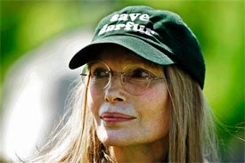 Illustration for article titled Mia Farrow: A Crazier, Older, More Altruistic Angelina Jolie?