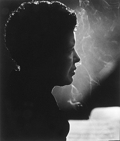 Billie Holiday photographed by Herman Leonard.