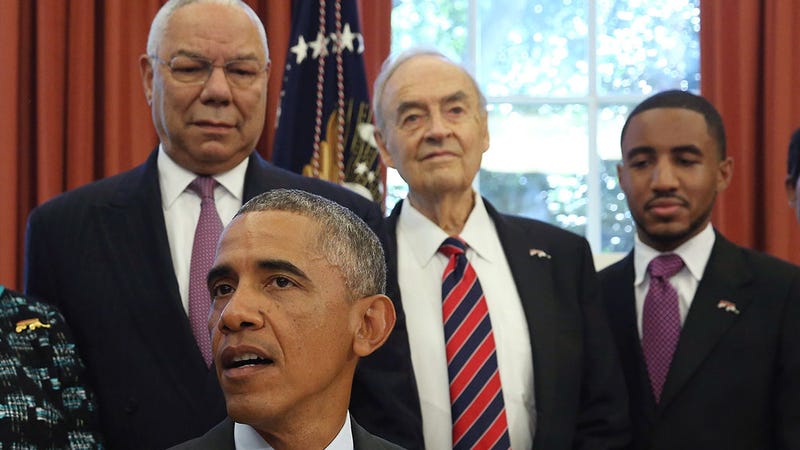 Former US Senator Harris Wofford, standing to the left of Colin Powell, and behind President Barack Obama