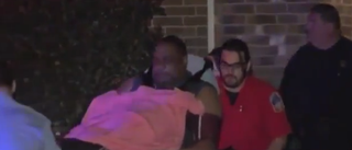 The unidentified father being carried to the ambulance YouTube screenshot