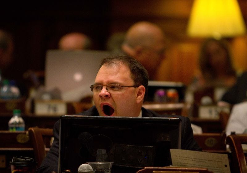 Republican Georgia State Rep. Jason Spencer yawns as proceedings continue into the night in the House chamber on the final day of the legislative session Thursday, April 14, 2011 in Atlanta.