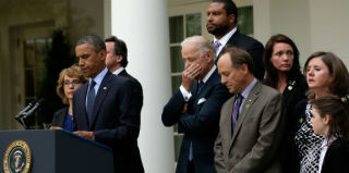 President Obama and Vice President Biden are joined by supporters of background-check legislation. (Win McNamee/Getty Images)