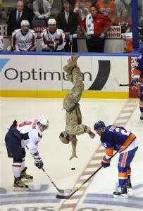 Illustration for article titled Air National Guardsman Rappels From Rafters, Drops Ceremonial First Puck At Islanders Capitals Game