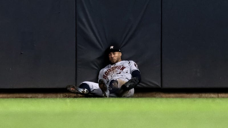 Illustration for article titled George Springer Carted Off After Smashing Head Into Outfield Wall During Acrobatic Catch