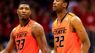 Marcus Smart (left) and teammate Markel Brown during a game against the Kansas Jayhawks on Jan. 18, 2014, in Lawrence, Kansas.Jamie Squire/Getty Images