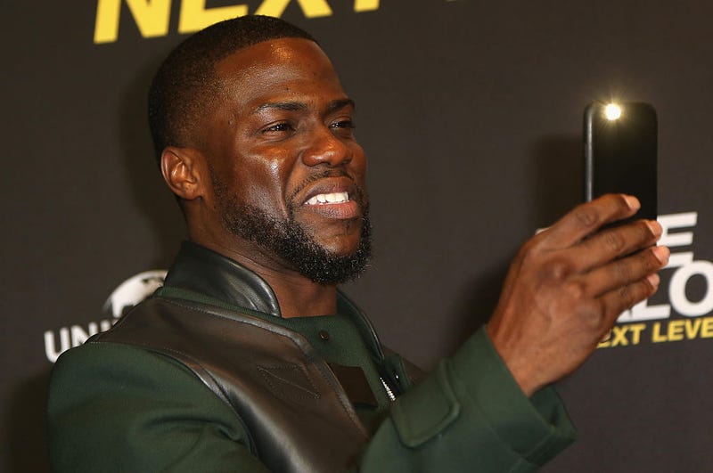 Kevin Hart takes pictures with his mobile phone during a photo call for the film Ride Along: Next Level Miami on Jan. 18, 2016, in Berlin.Adam Berry/Getty Image