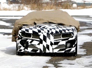 Illustration for article titled Firebird And Ice! Camo-Covered Trans Am Camaro Conversion Caught In Snow