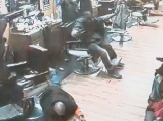 Surveillance footage captured inside the Next Up Barber &amp; Beauty in Columbia, S.C., Jan. 22, 2016, shows the moment a barber’s client opened fire on a robber who attempted to stick up customers inside the shop.WLTX screenshot