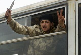 A Libyan rebel fighter holds a knife. (ODD ANDERSEN/AFP/Getty Images)
