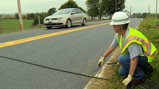 Here's What Those Weird Black Tubes In The Road Are For