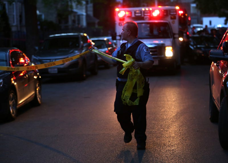 Police expand the crime scene in the 3900 block of West Lexington Street, where a 20-year-old woman suffered a gunshot wound to the head, in Chicago on May 28, 2016.E. Jason Wambsgans/Chicago Tribune/TNS via Getty Images