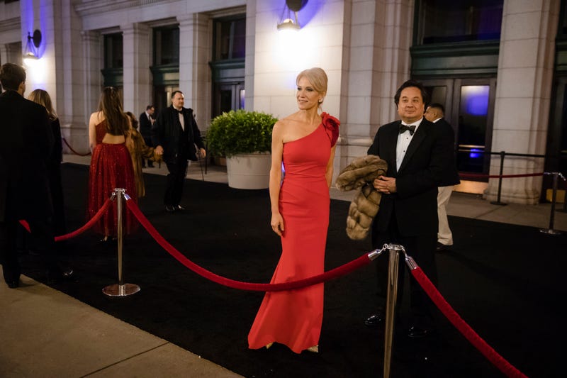 Kellyanne Conway, center, accompanied by her husband, George, speaks with members of the media as they arrive for a dinner at Union Station in Washington, the day before Trump’s inauguration. (AP Photo/)
