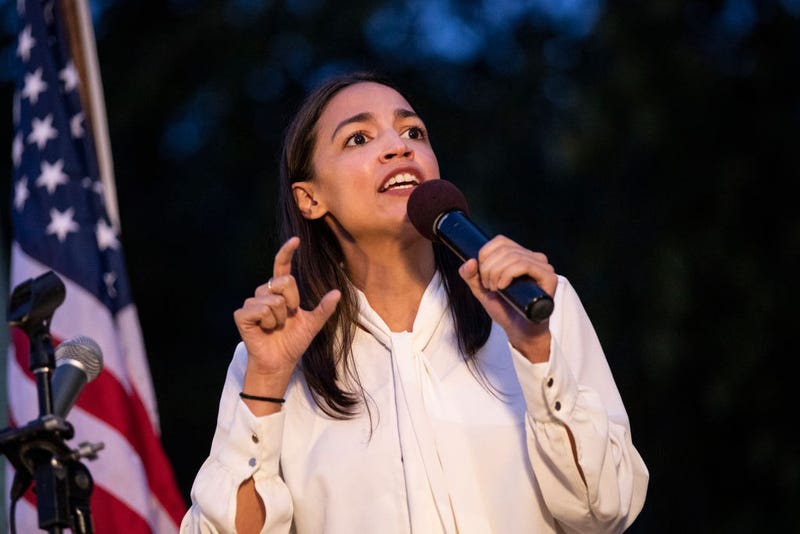 Illustration for article titled Alexandria Ocasio-Cortez Calls Out Mitch McConnell After 'Team Mitch' Thugs Groped and Choked an AOC Cutout