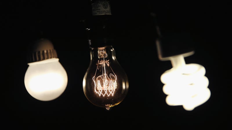 A CFL bulb (right), a vintage-style incandescent bulb (center), and an LED bulb (left).