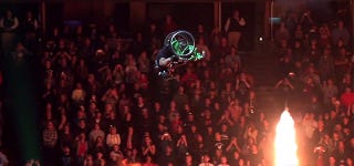 Illustration for article titled Badass guy does a front-flip over a 50-foot gap in a wheelchair