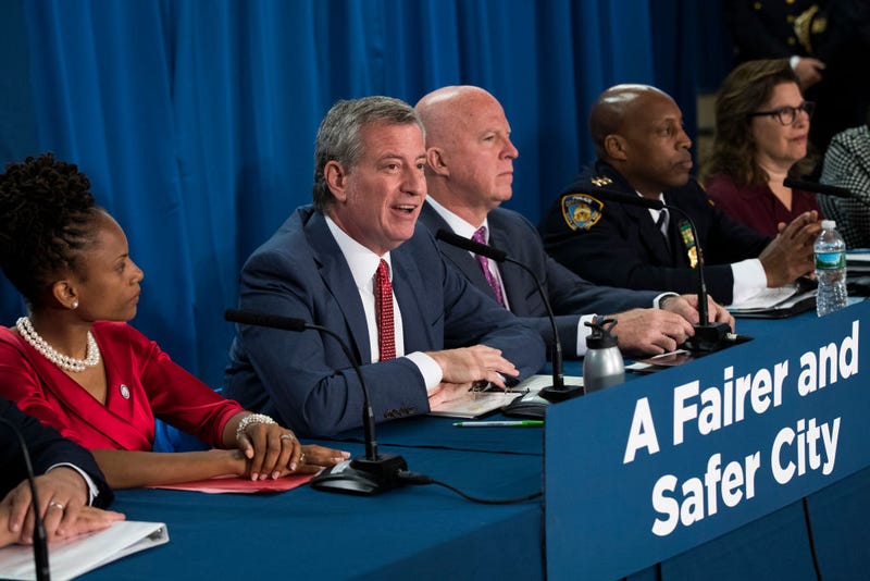 Community organizer Monique Waterman, New York City Mayor Bill de Blasio, New York City Police Commissioner James O’Neill and NYPD Chief of Patrol Rodney Harrison hold a press conference to announce a new policy that they say will reduce unnecessary marijuana arrests on June 19, 2018, in New York City.