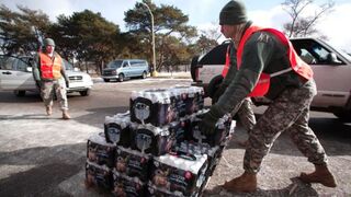 Soldiers from the Michigan Army National Guard Flint prepare to give Flint, Mich., residents bottled water at a fire station Jan. 17, 2016, in Flint.Bill Pugliano/Getty Images