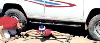 Illustration for article titled This Kid Totally Rules: Sets Automotive Roller-Skate Limbo Record!