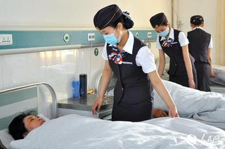 Illustration for article titled Nurses Cosplay as Flight Attendants at a Chinese Hospital
