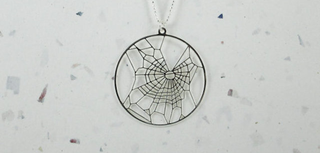Illustration for article titled Hidden in This Beautiful Jewelry is a Secret Drug-Science Reference