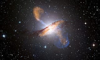 Illustration for article titled Dark matter and black holes are teaming up to produce giant "burps" of gamma radiation