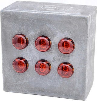 Illustration for article titled Concrete Nixie Clock Tells Time, Requires a Sturdy Table