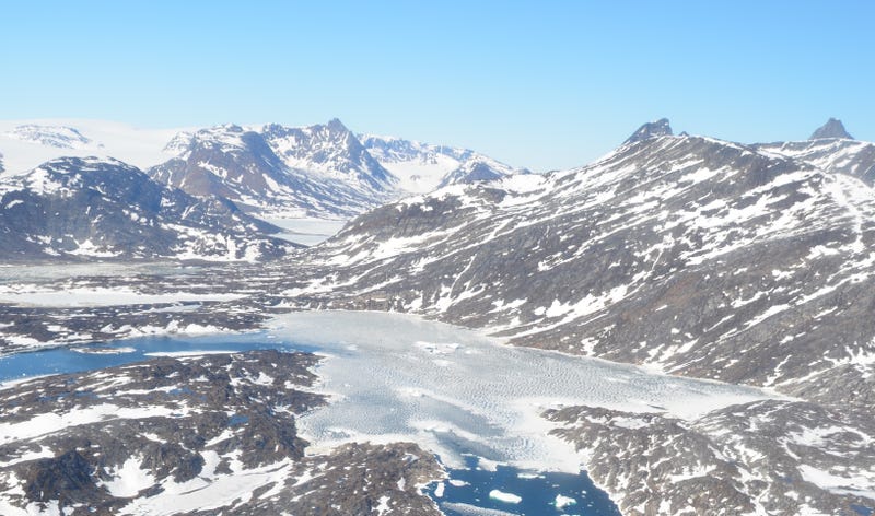 Fjord filled with melting sea ice and icebergs in East Greenland in June. Image: Paul Bierman