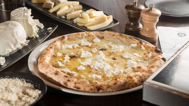 Illustration for article titled A pizza world champion made this 99-cheese pizza and it tastes fantastic