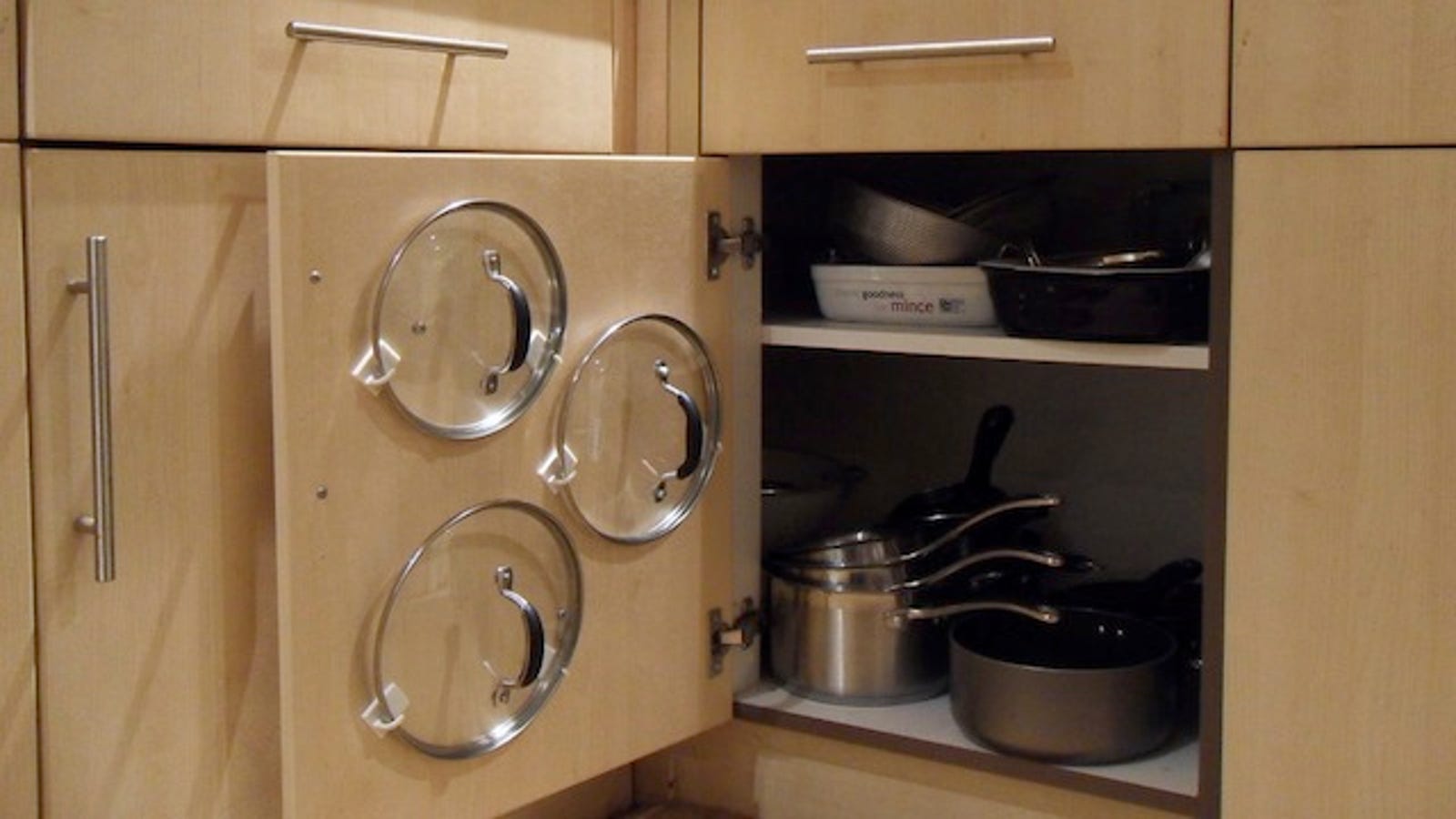Use Adhesive Hooks to Organize Your Pot Lids and Save Cabinet Space