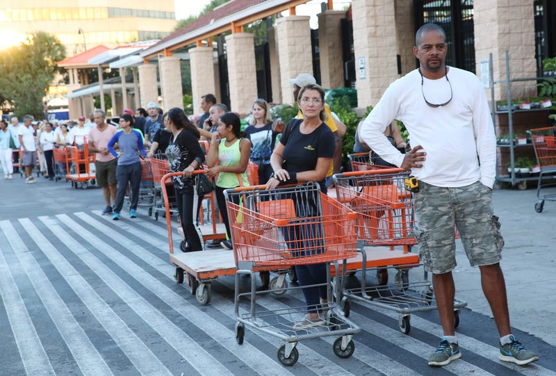 Eduardo Soriano of Miami, in front, started waiting in this line at dawn to purchase plywood sheets at a Home Depot store in North Miami, Fla., on Sept. 6, 2017. (Marta Lavandier/AP Images)