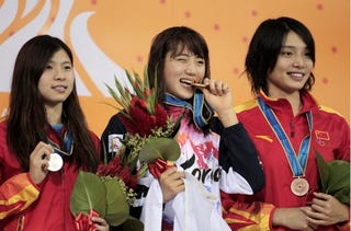 Illustration for article titled She Loves Her Gold Medal So Much She Could Eat It