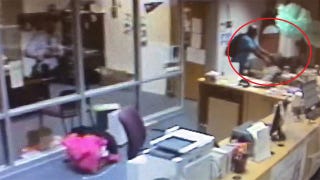 A South Atlanta High School teacher has been fired after video footage showed him violently showing a student across a desk.