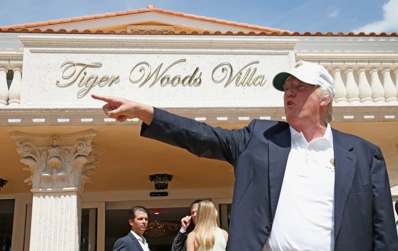 Donald Trump stands in front of the Tiger Woods Villa prior to the start of the World Golf Championships-Cadillac Championship at Trump National Doral on March 5, 2014 in Doral, Florida.