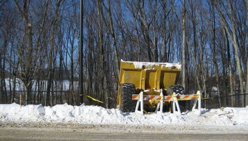 Illustration for article titled Giant Dump Truck Tries Sledding, Fails Miserably
