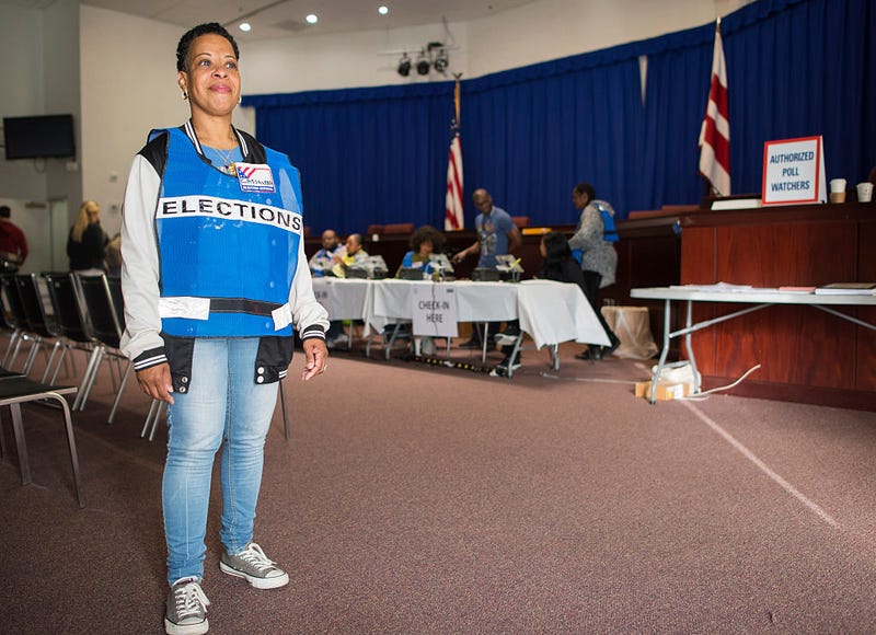 Election official Cassandra Lewis waits to welcome voters at an early-voting poll station in Washington, D.C., on Oct. 25, 2016. ANDREW CABALLERO-REYNOLDS/AFP/Getty Images
