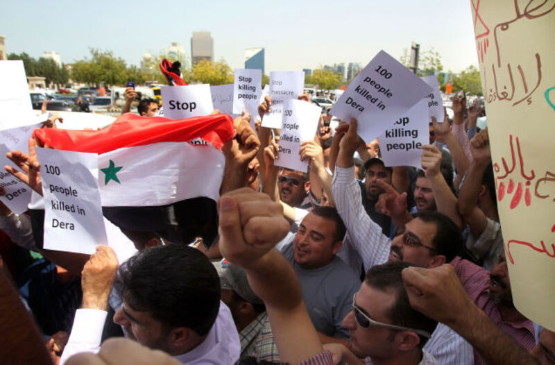 Syrian nationals demonstrate outside the Syrian Consulate in Dubai. (Karim Sahib/Getty Images)