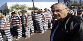 Maricopa County Sheriff Arpaio stands with prisoners. (Google)