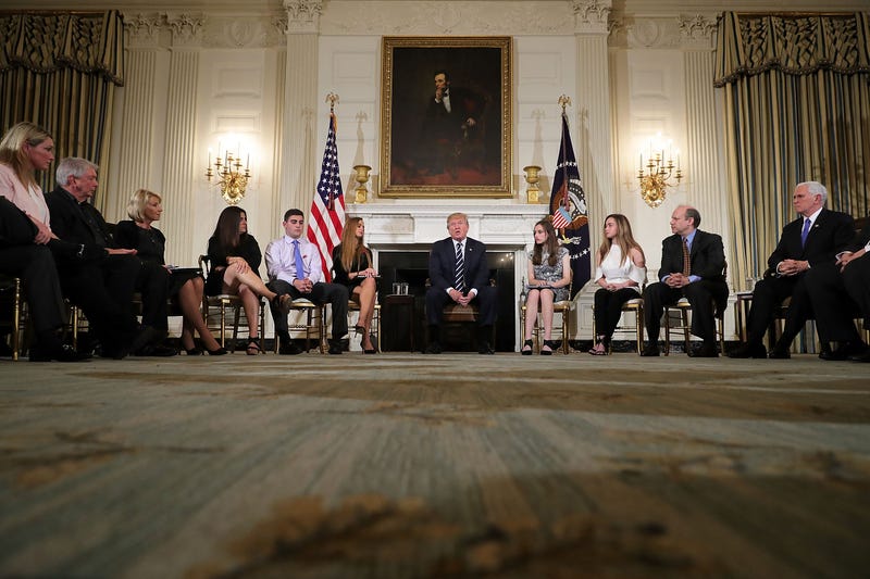 President Donald Trump (center) holds a listening session with student survivors of mass shootings, their parents and teachers in the State Dining Room at the White House in Washington, D.C.. on Feb. 21, 2018. (Chip Somodevilla/Getty Images)