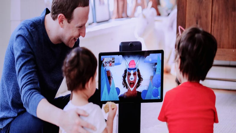 Facebook CEO Mark Zuckerberg shows unnamed kids one of the social media giant’s latest in-home spy devices